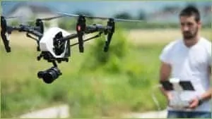A man flying a drone. [Image Source: Ia.acs.org.au]
