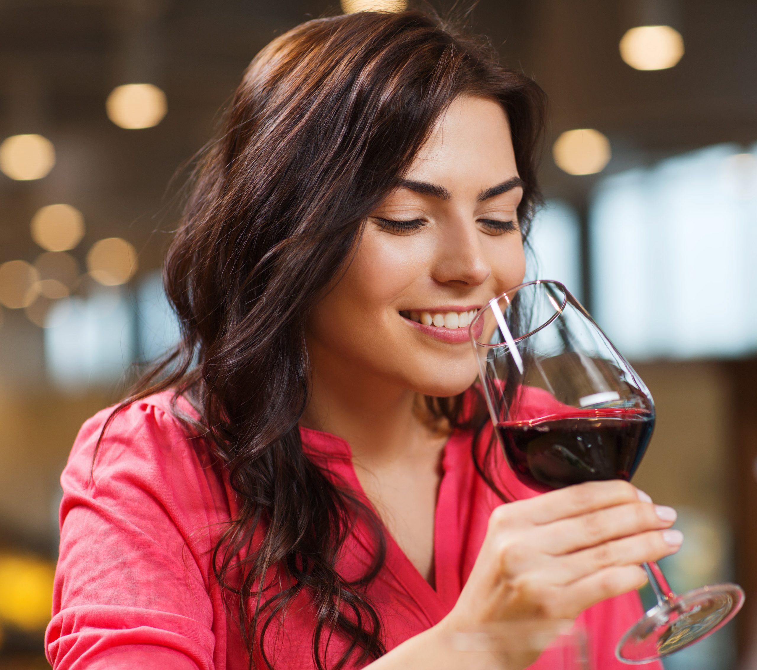 Beautifull Woman Testing red Wine in Restaurant