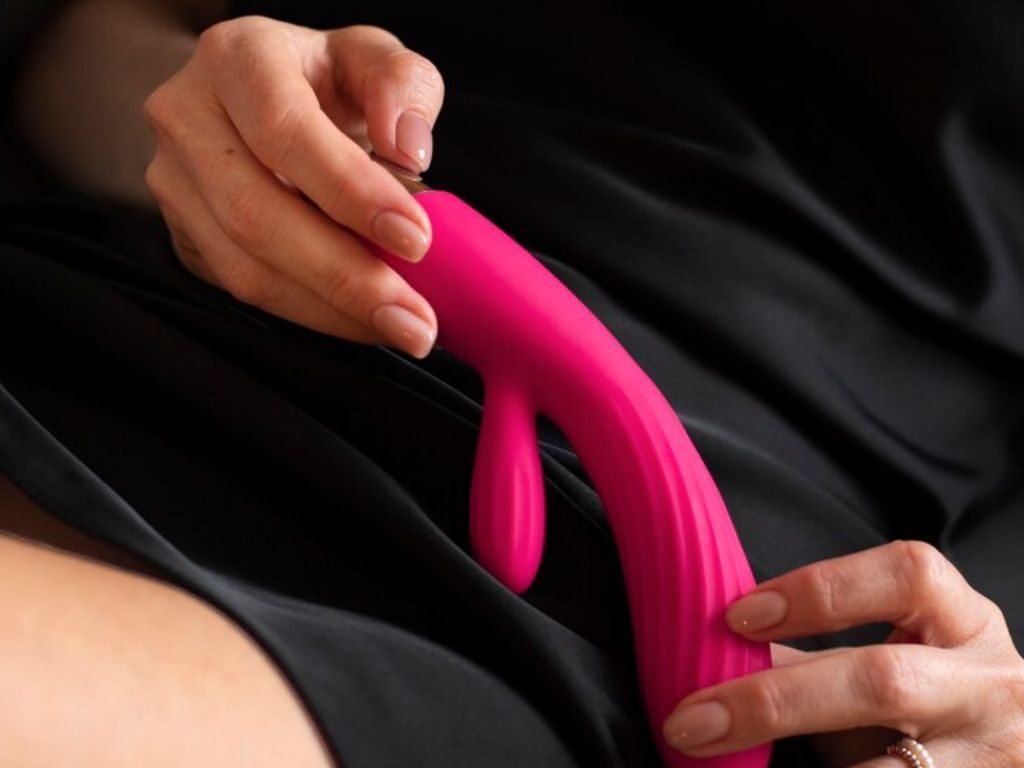 woman holding sex toy