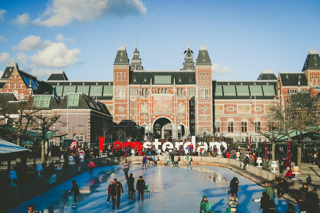 People ice skating in front of Rijksmuseum in Amsterdam, one of the most welcoming cities to work abroad