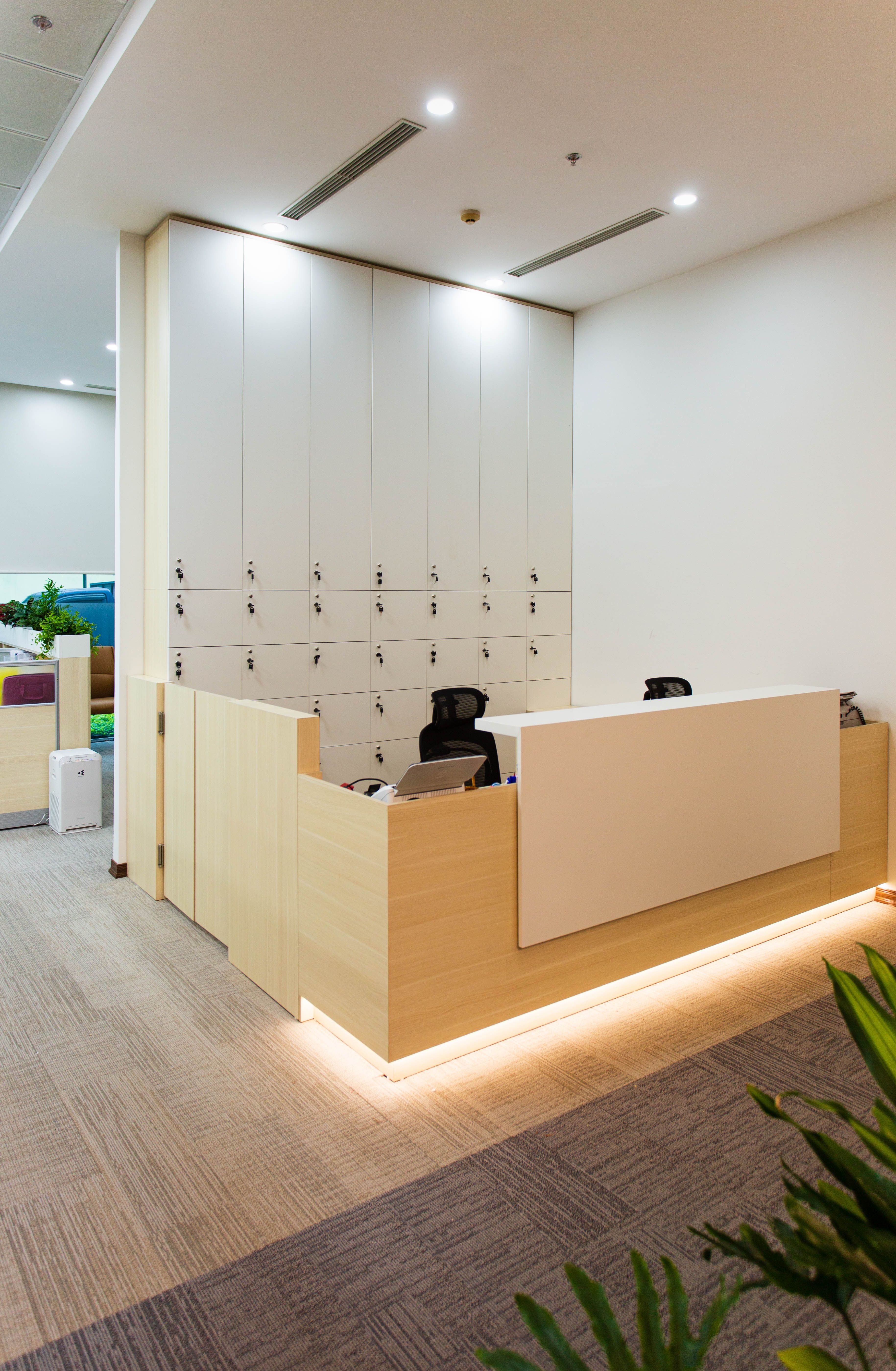 Sleek modern office reception area with minimalist design and built-in lighting, the first impression of a brand