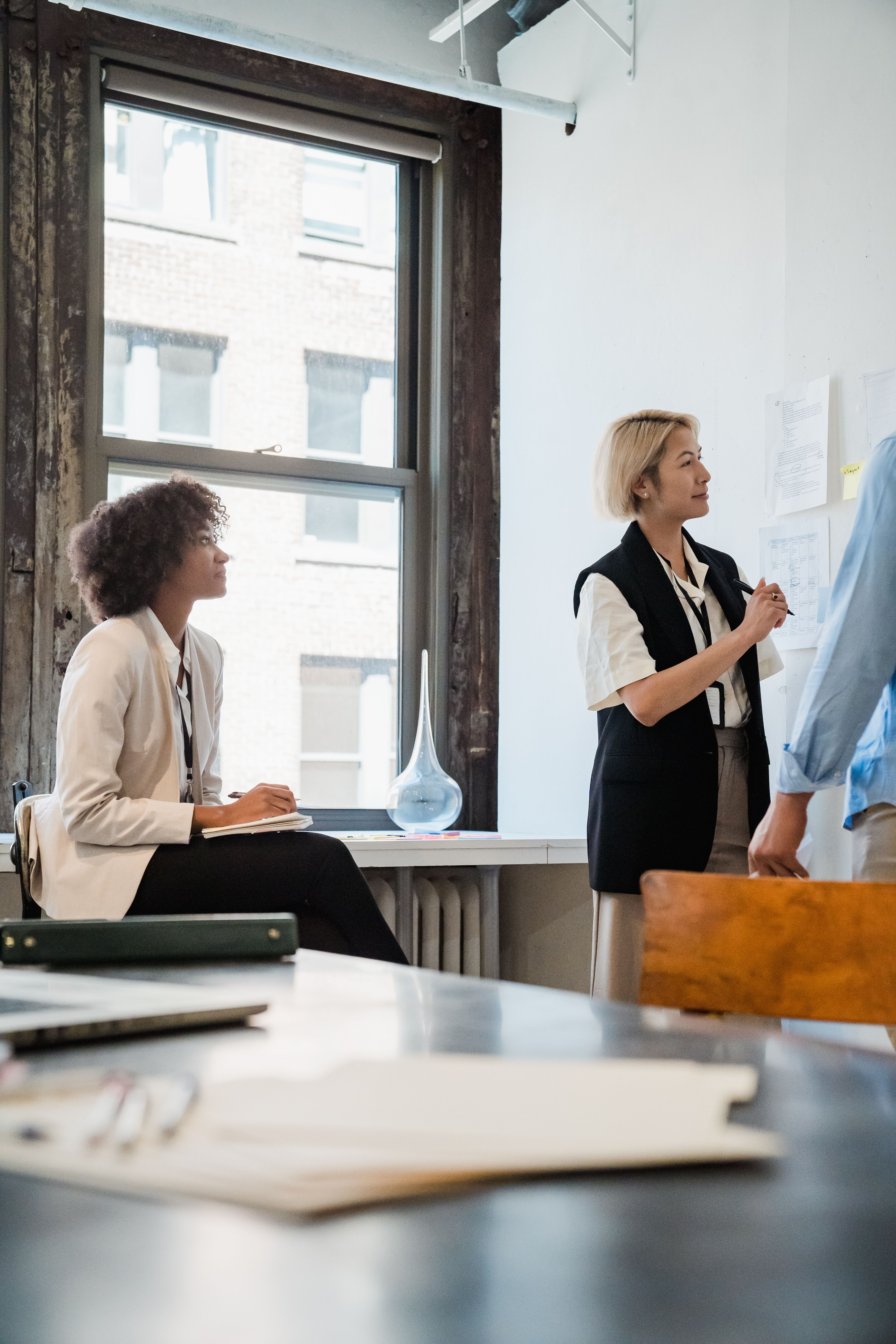 Professional team collaborating on a project in a clean, well-lit office space